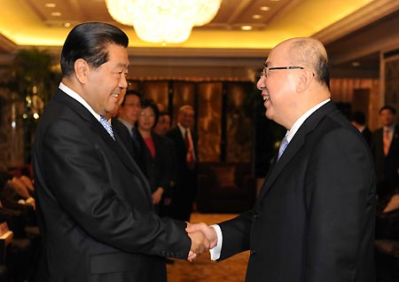 Jia Qinglin (L), member of the Standing Committee of the Communist Party of China Central Committee Political Bureau and chairman of the National Committee of the Chinese People's Political Consultative Conference (CPPCC), meets with Chairman of Chinese Taiwan's ruling Kuomintang party Wu Poh-hsiung in Shanghai, east China, on Dec. 19, 2008.