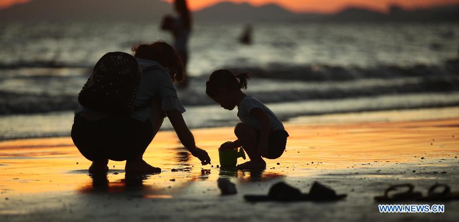 Beautiful sunset at seashore in Sanya